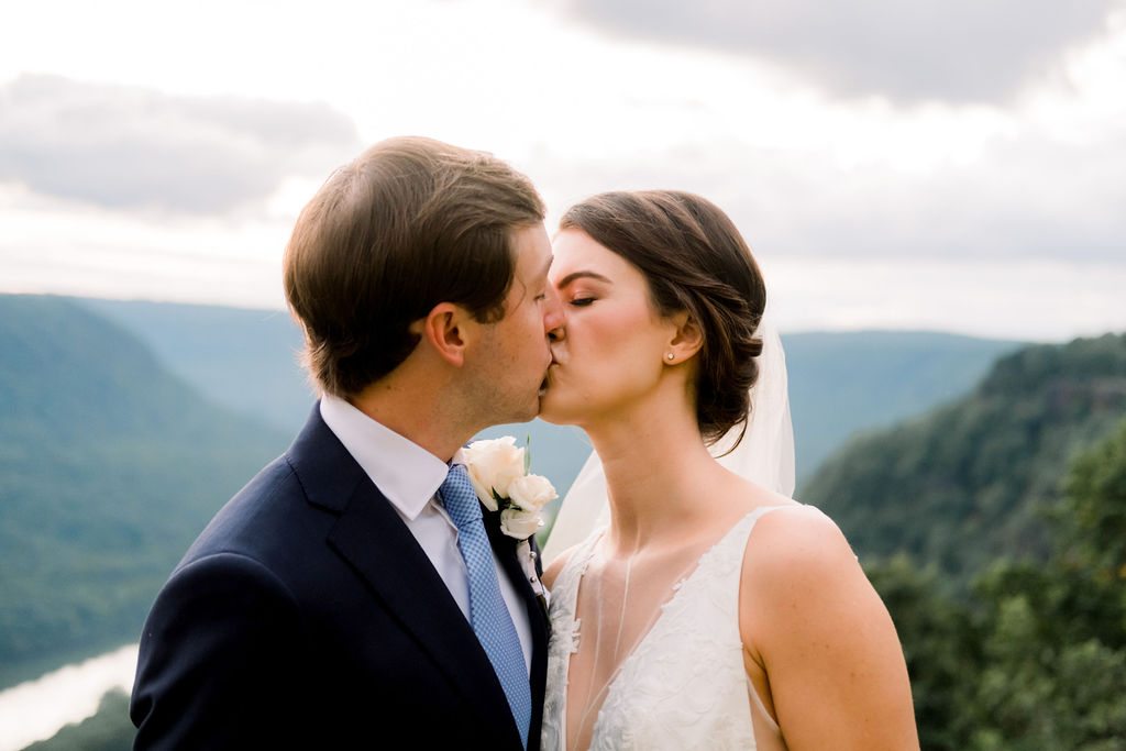 bride and groom kissing celebrating recent marriage