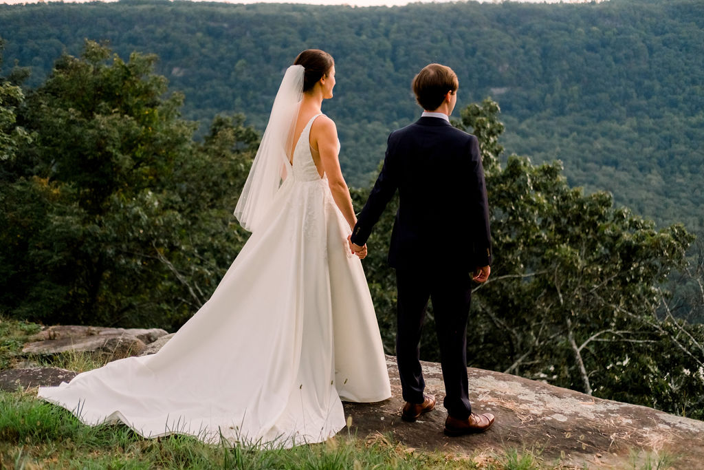 bride and groom looking over the view after their wedding ceremony