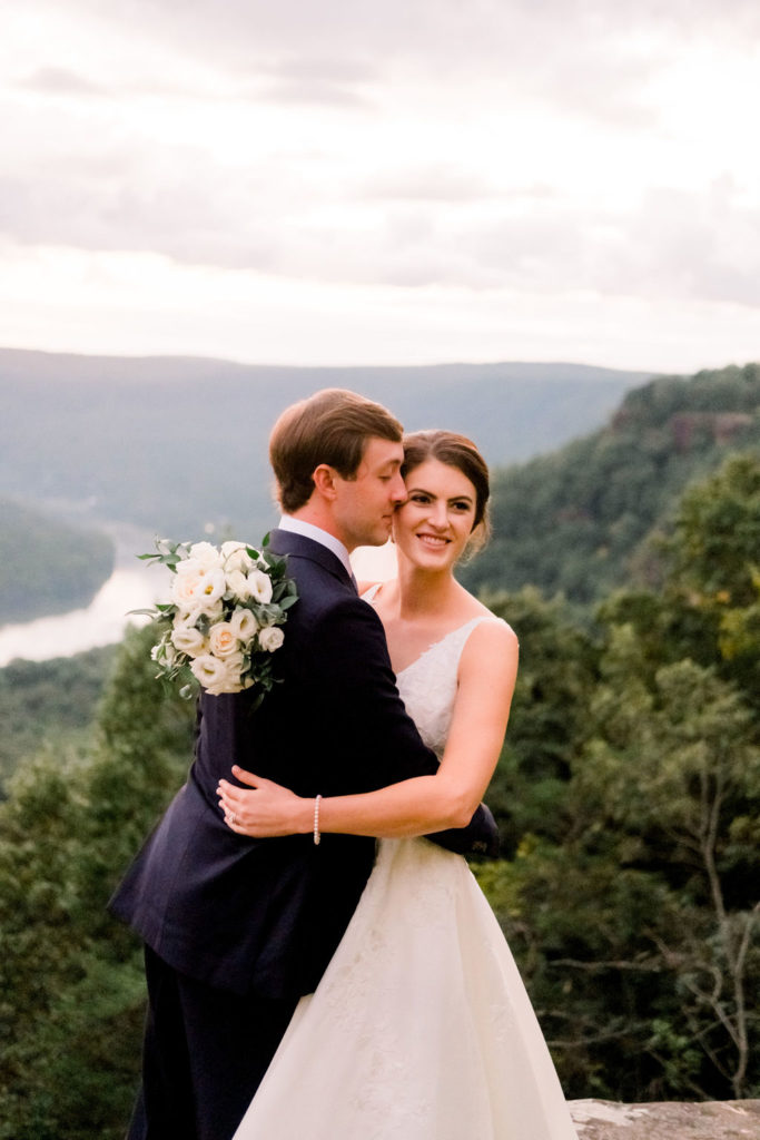 bride and groom hugging and kissing after signal mountain micro wedding