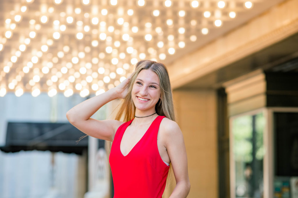 young woman wearing red dress during chattanooga outdoor senior session