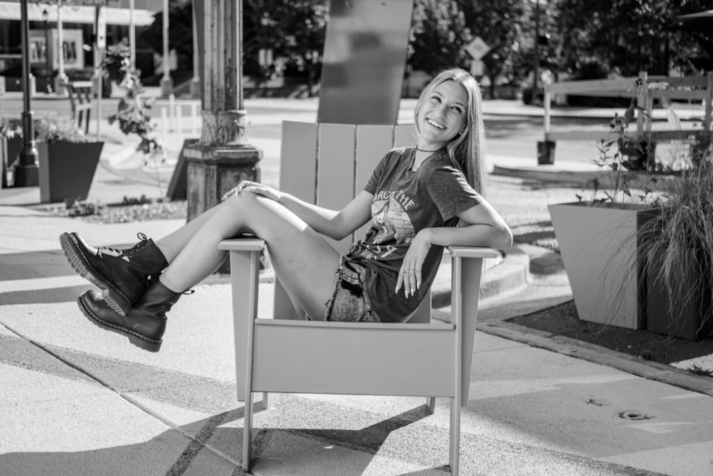 young woman sitting in chair in downtown chattanooga