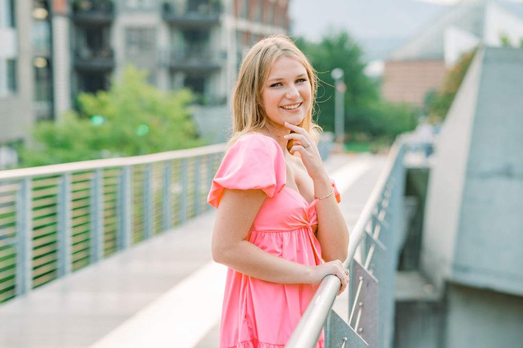 young tennessee girl wearing pink dress on bridge near downtown