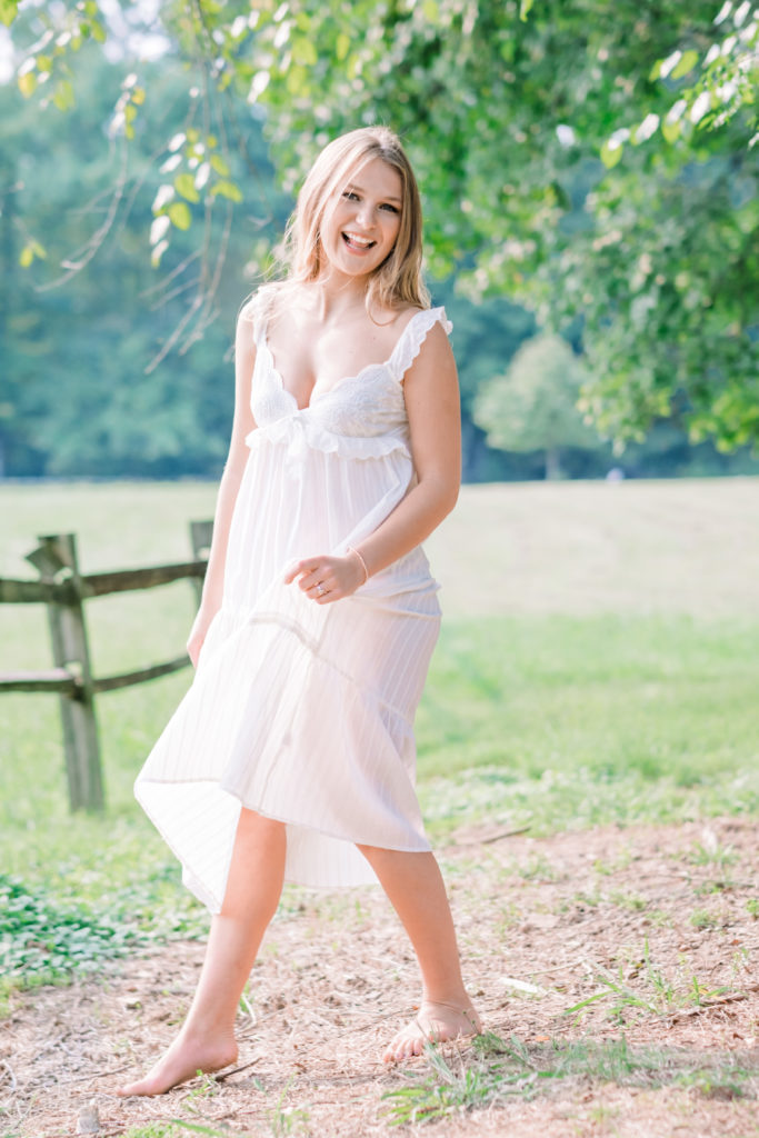 young Tennessee girl smiling wearing white dress outdoors