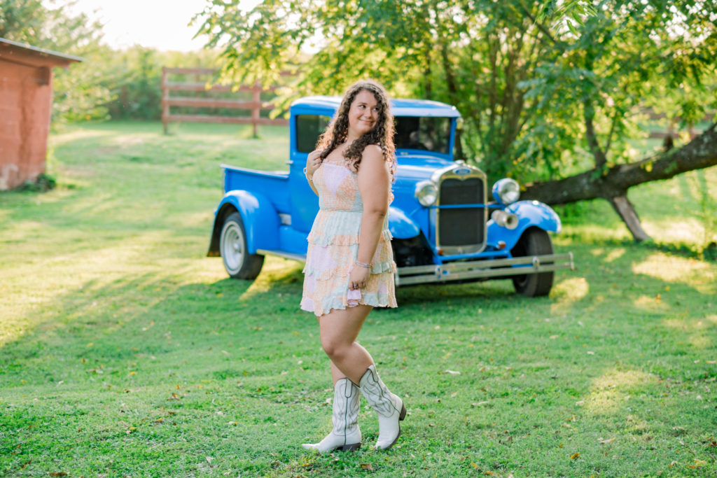 Young tennessee senior posing in front of Grandfather's truck during Chickamauga Battlefield outdoor session